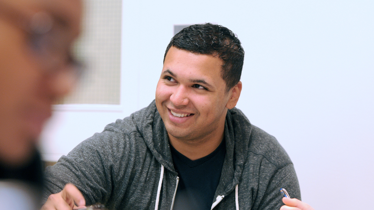 A student smiles in class